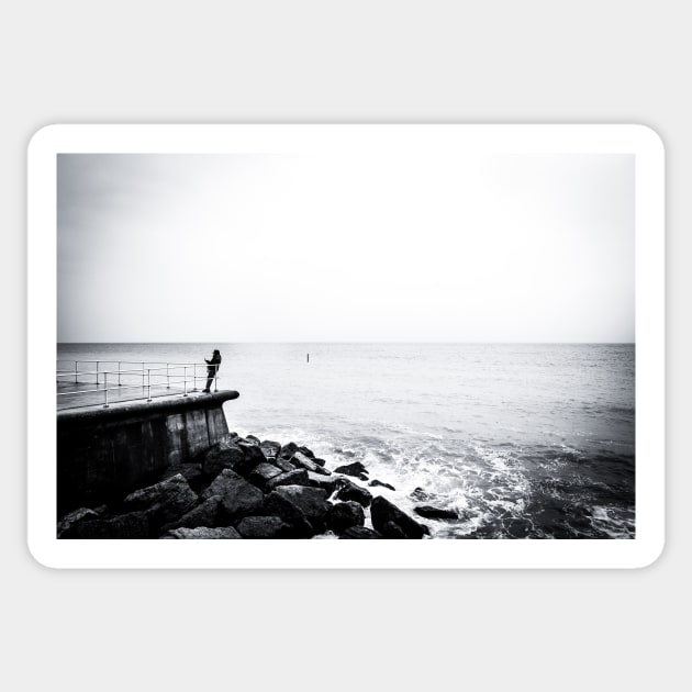 Solitary man at Cromer beach in Norfolk Sticker by stuartchard